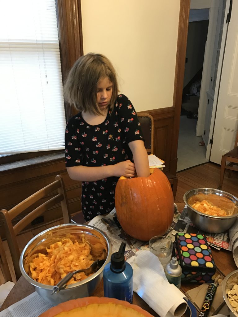 Ruby Carving her Pumpkin
