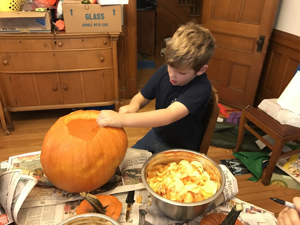 Edward Carving his Pumpkin